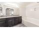 Bathroom features double vanity and soaking tub with shower at 611 Bass Dr # C, Henderson, NV 89014
