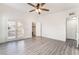 Inviting bedroom featuring modern flooring, ceiling fan, and patio access at 611 Bass Dr # C, Henderson, NV 89014