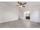 Spacious bedroom featuring modern flooring and archway to the bathroom at 611 Bass Dr # C, Henderson, NV 89014