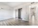 Bright bedroom features modern flooring and closet with mirrored doors at 611 Bass Dr # C, Henderson, NV 89014