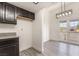 The dining area features modern lighting and French doors leading to a patio at 611 Bass Dr # C, Henderson, NV 89014