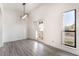 Dining room area with modern light fixture and outdoor views at 611 Bass Dr # C, Henderson, NV 89014