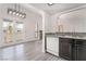 Spacious kitchen and eating area featuring backyard access through French doors at 611 Bass Dr # C, Henderson, NV 89014