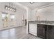 Spacious kitchen and eating area featuring backyard access through French doors at 611 Bass Dr # C, Henderson, NV 89014