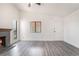 Living room with modern flooring and a brick fireplace at 611 Bass Dr # C, Henderson, NV 89014