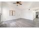 Spacious living room with grey floors and a white door at 611 Bass Dr # C, Henderson, NV 89014