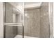 The shower features a glass door, a shower head, and tiled walls at 611 Bass Dr # C, Henderson, NV 89014