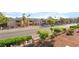 Street view of the community with mature trees and landscaping in front of the property at 611 Bass Dr # C, Henderson, NV 89014