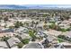 Neighborhood aerial showcasing various homes with pools and desert landscaping at 6150 Bunker Commons Ct, Las Vegas, NV 89108