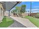 Backyard features pavers, artificial turf, and a covered pergola-style patio at 6150 Bunker Commons Ct, Las Vegas, NV 89108