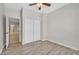 Empty bedroom showcasing wood-look flooring and a closet with sliding doors, offering a clean and spacious area at 6150 Bunker Commons Ct, Las Vegas, NV 89108