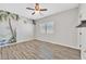 Bedroom with wood-look floors and a tropical mural, offering a bright and unique space at 6150 Bunker Commons Ct, Las Vegas, NV 89108