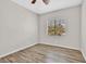 Simple bedroom with a window, neutral paint, and light wood flooring at 6150 Bunker Commons Ct, Las Vegas, NV 89108