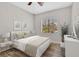 Bright bedroom with neutral tones, featuring a cozy bed, window views, and stylish decor accents at 6150 Bunker Commons Ct, Las Vegas, NV 89108