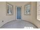 Inviting front entry with a blue door framed by windows, showcasing natural light and curb appeal at 6150 Bunker Commons Ct, Las Vegas, NV 89108