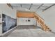 Spacious garage with a custom loft and staircase, ready for storage or hobbies at 6150 Bunker Commons Ct, Las Vegas, NV 89108
