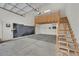 Spacious garage with a custom loft and staircase, ready for storage or hobbies at 6150 Bunker Commons Ct, Las Vegas, NV 89108