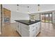 Modern kitchen island with sleek countertops, white cabinetry, and pendant lighting at 6150 Bunker Commons Ct, Las Vegas, NV 89108