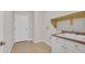 A well-lit laundry room offers tile flooring, neutral walls, and a utility sink at 6150 Bunker Commons Ct, Las Vegas, NV 89108