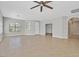 Large living room with modern tile floors, neutral walls, and natural light at 6150 Bunker Commons Ct, Las Vegas, NV 89108
