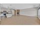Open-concept living room features a modern kitchen with stainless appliances, fireplace and tile floors at 6150 Bunker Commons Ct, Las Vegas, NV 89108