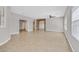 Open-concept living space with tile floors, neutral walls, and archway leading to other rooms at 6150 Bunker Commons Ct, Las Vegas, NV 89108