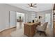 Home office with modern desk, chair, and view into the dining room at 6150 Bunker Commons Ct, Las Vegas, NV 89108