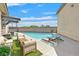 Inviting backyard pool with lush artificial grass and stylish outdoor lounge furniture at 6150 Bunker Commons Ct, Las Vegas, NV 89108
