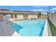 Sparkling blue pool with steps, paired with solar panels for energy efficiency at 6150 Bunker Commons Ct, Las Vegas, NV 89108