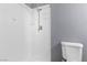 Bright bathroom featuring a tiled shower with updated fixtures and a modern toilet at 6223 Foothill Blvd, Las Vegas, NV 89118