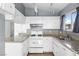 Well-lit kitchen featuring white cabinets, light countertops and modern appliances at 6223 Foothill Blvd, Las Vegas, NV 89118