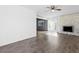 Open living room with wood floors, lots of light, and a charming fireplace at 6223 Foothill Blvd, Las Vegas, NV 89118