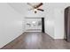 Bright living room featuring wood floors, ceiling fan, and a comfortable window seat at 6223 Foothill Blvd, Las Vegas, NV 89118