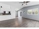 Spacious and bright living room with wood flooring adjacent to the kitchen at 6223 Foothill Blvd, Las Vegas, NV 89118