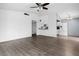 Large living room featuring wood floors, ceiling fan, and open concept to the kitchen at 6223 Foothill Blvd, Las Vegas, NV 89118