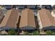 An aerial view of the roofs of homes in a community with an attached back yard and street parking at 6420 Extreme Shear Ave # 102, Henderson, NV 89011