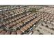 An aerial view showcases rows of homes in a neighborhood with street parking and some green spaces at 6420 Extreme Shear Ave # 102, Henderson, NV 89011