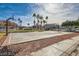 Community basketball court featuring well-maintained grounds, palm trees, and residential surroundings at 6420 Extreme Shear Ave # 102, Henderson, NV 89011