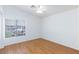 Bright bedroom with wood floors, a ceiling fan, and a large window at 6420 Extreme Shear Ave # 102, Henderson, NV 89011