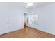 Bedroom with wood floors and arched entry to a bathroom at 6420 Extreme Shear Ave # 102, Henderson, NV 89011