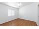 Bedroom with wood floors, ceiling fan and lots of natural light at 6420 Extreme Shear Ave # 102, Henderson, NV 89011