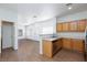 Open concept kitchen with breakfast bar overlooking the dining and living area. Stainless steel dishwasher included at 6420 Extreme Shear Ave # 102, Henderson, NV 89011