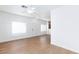 Bright living room featuring wood floors, white walls, and ample natural light at 6420 Extreme Shear Ave # 102, Henderson, NV 89011