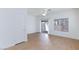 Living room with hardwood floors, natural light, ceiling fan, and access to the patio at 6420 Extreme Shear Ave # 102, Henderson, NV 89011