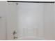 Bright shower with white tile and updated fixtures at 6420 Extreme Shear Ave # 102, Henderson, NV 89011