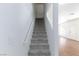 Carpeted stairway with white handrail leading to the upper level of the home at 6420 Extreme Shear Ave # 102, Henderson, NV 89011