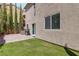 Backyard with pavers, turf, and privacy landscaping at 6731 Sumatra St, Las Vegas, NV 89166