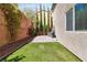 Backyard featuring manicured lawn, pavers, and lush landscaping at 6731 Sumatra St, Las Vegas, NV 89166