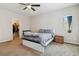 Cozy bedroom features carpet floors, modern ceiling fan, and small window with curtain at 6731 Sumatra St, Las Vegas, NV 89166