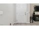 Clean entryway with neutral walls, tile flooring, and a practical storage cabinet and shoe rack at 6731 Sumatra St, Las Vegas, NV 89166